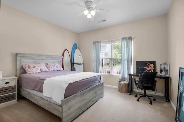 bedroom with carpet flooring, baseboards, and ceiling fan