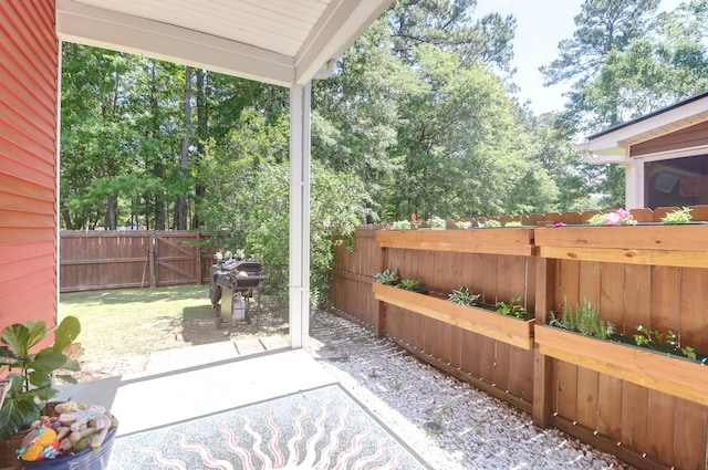 view of patio with a fenced backyard and a gate