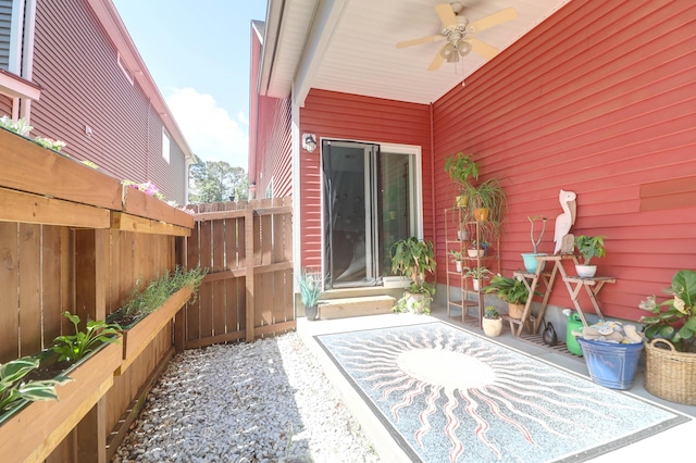 view of patio / terrace with a ceiling fan and fence