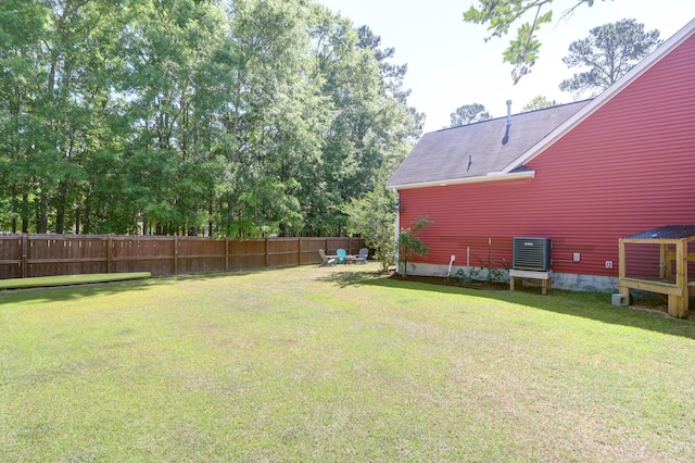view of yard with central air condition unit