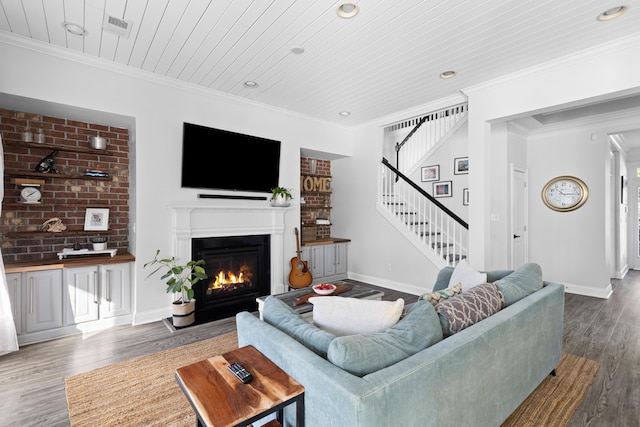 living room featuring wood ceiling, crown molding, and hardwood / wood-style flooring