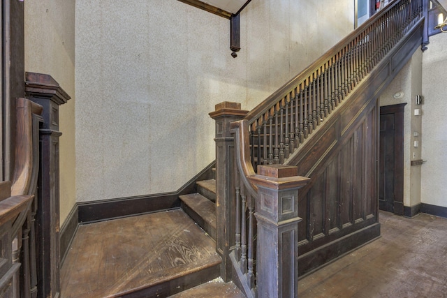 stairs with concrete flooring