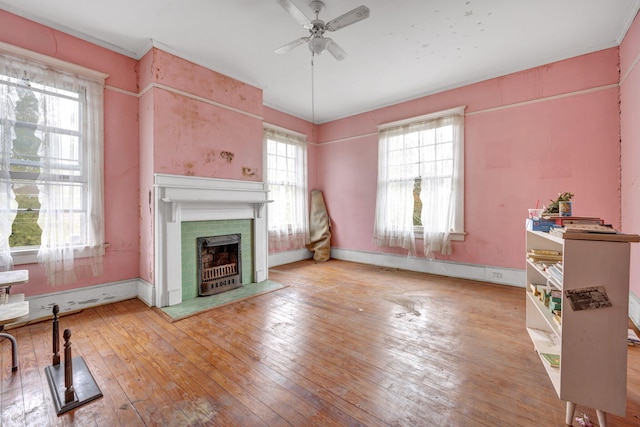 living room featuring ceiling fan and light wood-type flooring