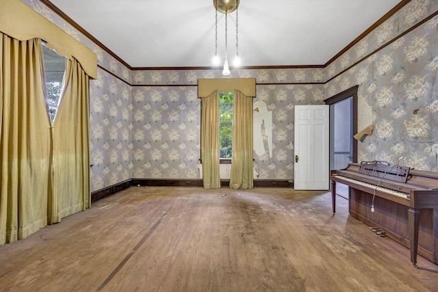 interior space featuring wood-type flooring and ornamental molding