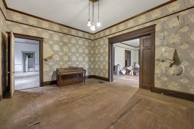 hallway featuring hardwood / wood-style floors and ornamental molding