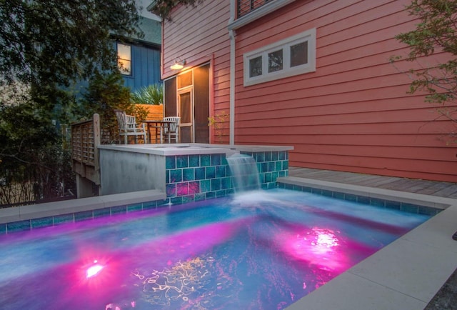 view of pool featuring a jacuzzi and pool water feature