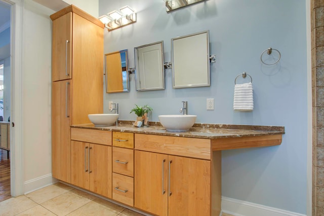 bathroom with vanity and tile patterned flooring