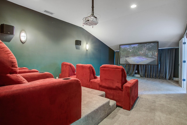 cinema featuring light carpet and lofted ceiling