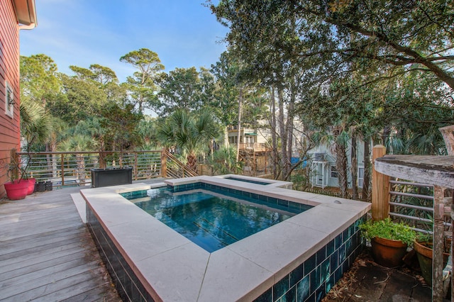 view of pool featuring a wooden deck and an outdoor hot tub