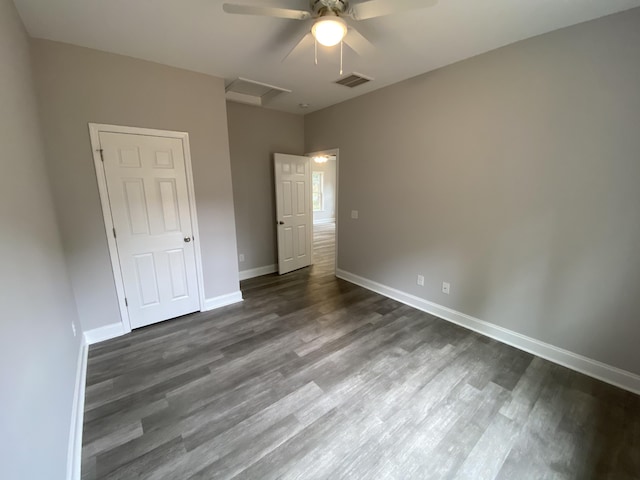 110A Dukes St, Saint George, SC 29477 - unfurnished bedroom featuring attic access, wood finished floors, baseboards, and ceiling fan