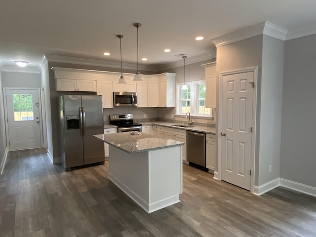110A Dukes St, Saint George, SC 29477 - kitchen featuring appliances with stainless steel finishes, dark wood-type flooring, healthy amount of natural light, crown molding, and recessed lighting