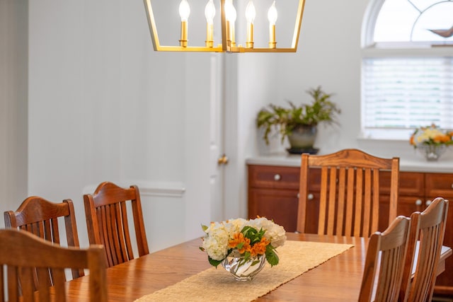 1977 Pierce St, Charleston, SC 29492 - dining room with a chandelier, a wealth of natural light, and wood finished floors