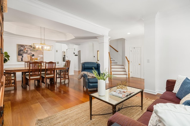1977 Pierce St, Charleston, SC 29492 - living room with ornamental molding, recessed lighting, ornate columns, wood finished floors, and stairs