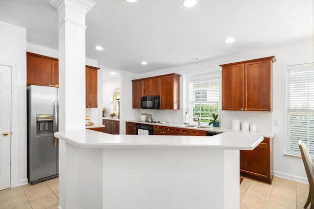 1977 Pierce St, Charleston, SC 29492 - kitchen with a sink, light tile patterned floors, light countertops, and black appliances
