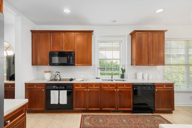 1977 Pierce St, Charleston, SC 29492 - kitchen featuring a sink, light countertops, black appliances, and plenty of natural light
