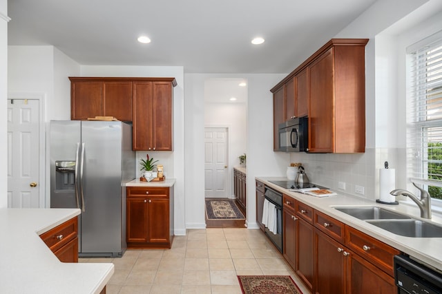 1977 Pierce St, Charleston, SC 29492 - kitchen with recessed lighting, light countertops, black appliances, decorative backsplash, and a sink