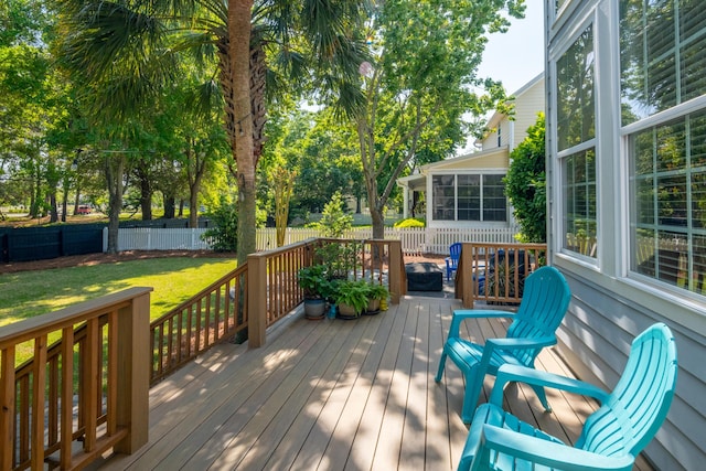 1977 Pierce St, Charleston, SC 29492 - deck with a sunroom, a fenced backyard, and a lawn