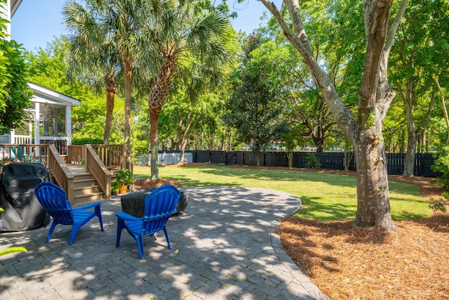 1977 Pierce St, Charleston, SC 29492 - view of patio featuring a fenced backyard, a wooden deck, and a sunroom