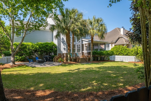 1977 Pierce St, Charleston, SC 29492 - view of yard featuring a sunroom, a patio, a fenced backyard, and a deck