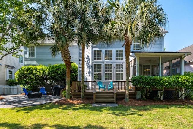 1977 Pierce St, Charleston, SC 29492 - rear view of property with a deck, a patio, a yard, and fence