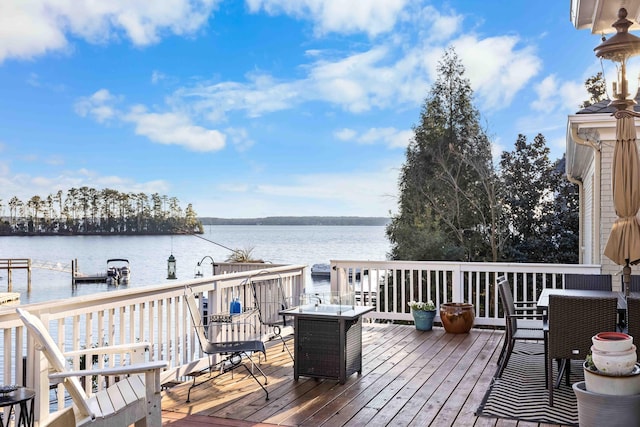 deck featuring a water view