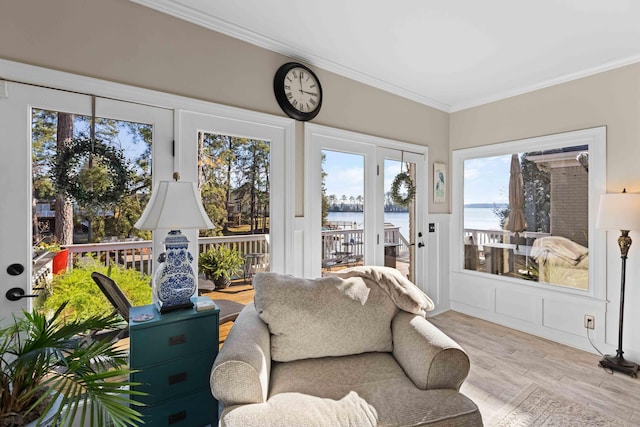 sunroom / solarium with a water view