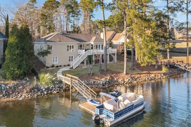 view of dock featuring a deck with water view