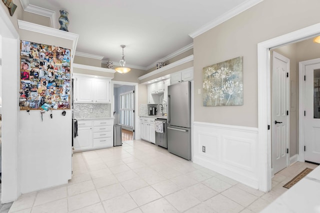 kitchen featuring appliances with stainless steel finishes, tasteful backsplash, decorative light fixtures, white cabinets, and light tile patterned flooring