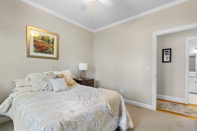 carpeted bedroom featuring ceiling fan, crown molding, and ensuite bathroom