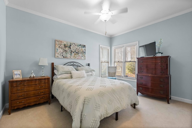 bedroom featuring ceiling fan, crown molding, and light colored carpet