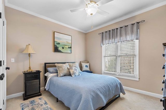 bedroom featuring ceiling fan, light colored carpet, and crown molding