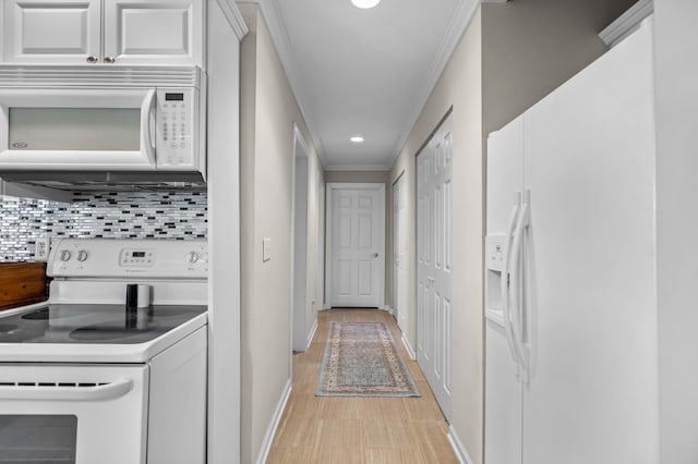 hallway with light wood-type flooring and crown molding