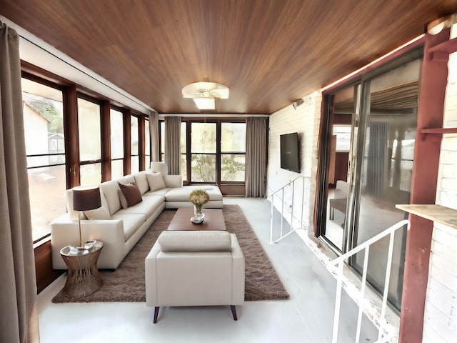 sunroom featuring wooden ceiling