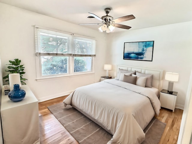 bedroom featuring ceiling fan and light hardwood / wood-style flooring