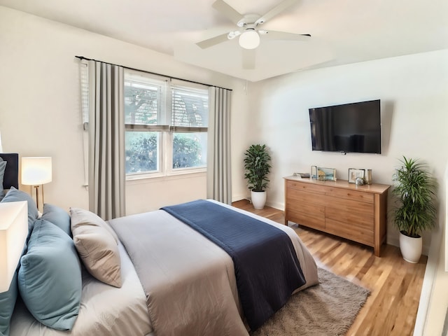 bedroom featuring hardwood / wood-style flooring and ceiling fan