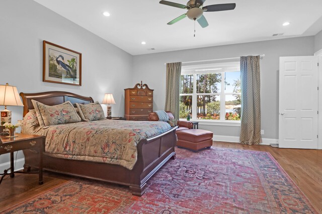 bedroom featuring wood-type flooring and ceiling fan