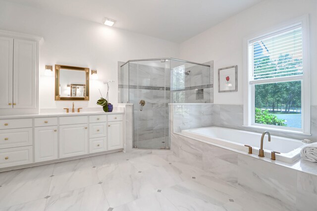 bathroom featuring vanity and plus walk in shower