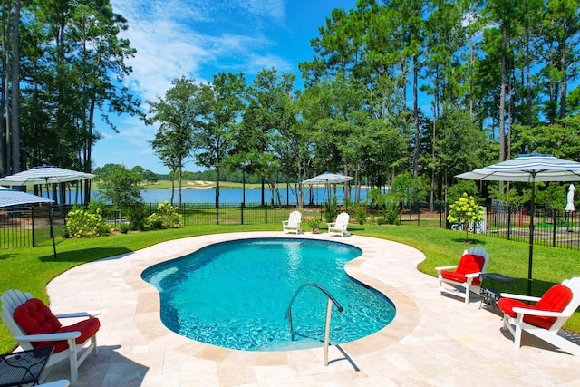 view of pool with a gazebo, a water view, a yard, and a patio area