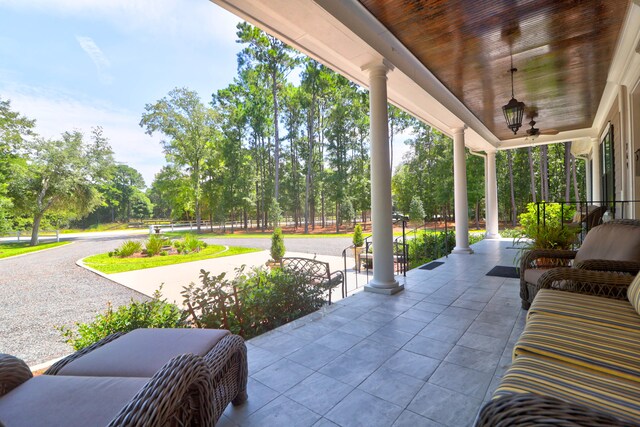 view of patio / terrace featuring ceiling fan and a porch