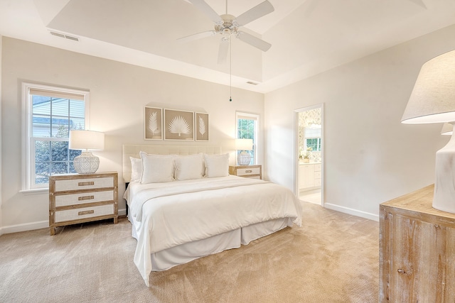 1148 Black Rush Cir, Mount Pleasant, SC 29466 - carpeted bedroom with baseboards, a tray ceiling, ensuite bathroom, and ceiling fan