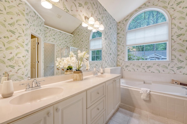 1148 Black Rush Cir, Mount Pleasant, SC 29466 - bathroom with wallpapered walls, vaulted ceiling, tile patterned flooring, a garden tub, and a stall shower