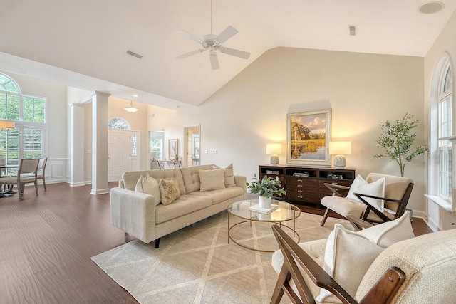1148 Black Rush Cir, Mount Pleasant, SC 29466 - living area featuring high vaulted ceiling, ceiling fan, wood finished floors, wainscoting, and ornate columns