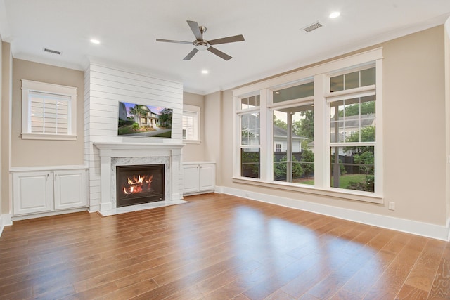 1363 Rivella Dr, Mount Pleasant, SC 29464 - unfurnished living room featuring a ceiling fan, wood finished floors, a high end fireplace, baseboards, and recessed lighting
