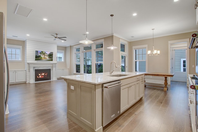 1363 Rivella Dr, Mount Pleasant, SC 29464 - kitchen featuring appliances with stainless steel finishes, a sink, dark wood-type flooring, open floor plan, and crown molding