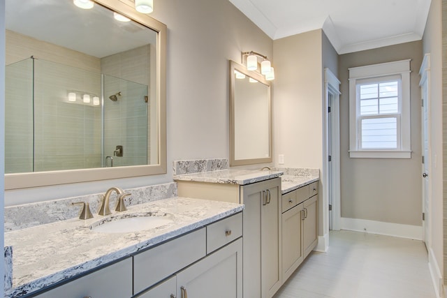 1363 Rivella Dr, Mount Pleasant, SC 29464 - bathroom featuring two vanities, a shower stall, ornamental molding, and baseboards