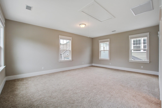1363 Rivella Dr, Mount Pleasant, SC 29464 - spare room featuring attic access, healthy amount of natural light, and baseboards