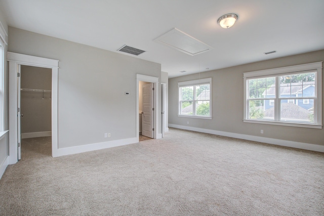 1363 Rivella Dr, Mount Pleasant, SC 29464 - unfurnished bedroom with attic access, baseboards, carpet floors, and a walk in closet