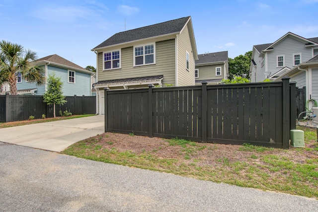 1363 Rivella Dr, Mount Pleasant, SC 29464 - view of front of property featuring concrete driveway, a residential view, and a garage