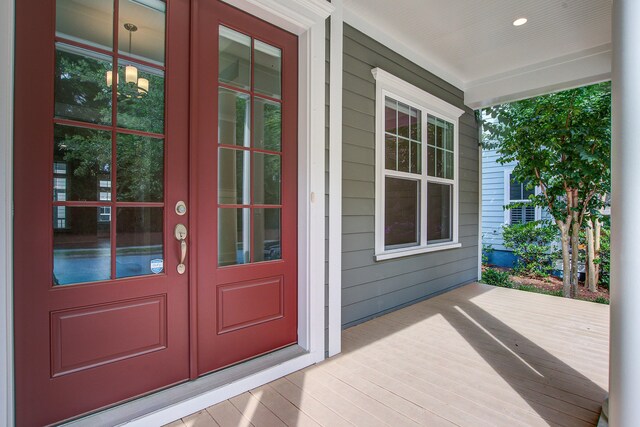 1363 Rivella Dr, Mount Pleasant, SC 29464 - view of exterior entry featuring french doors and a porch