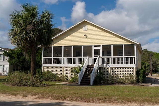 view of front of home with a sunroom